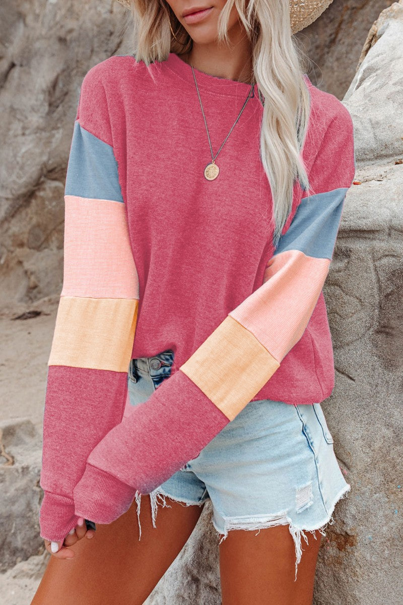 Pink Sweatshirt with colour block sleeves.