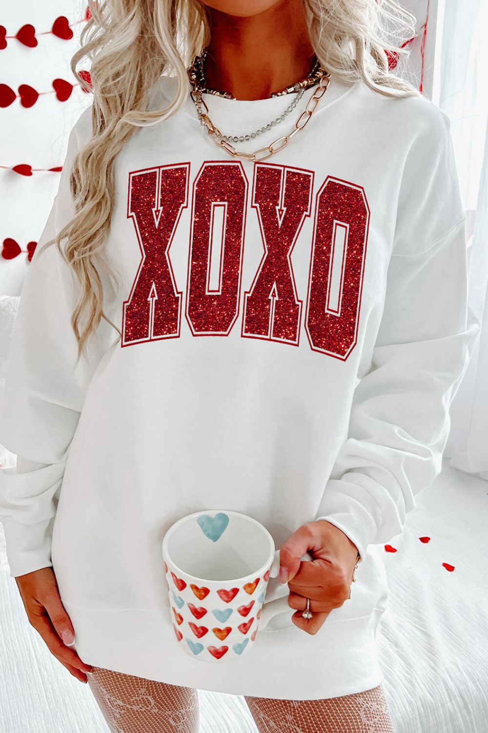 Large Print XOXO in Red Glitter effect across chest on a white Sweatshirt